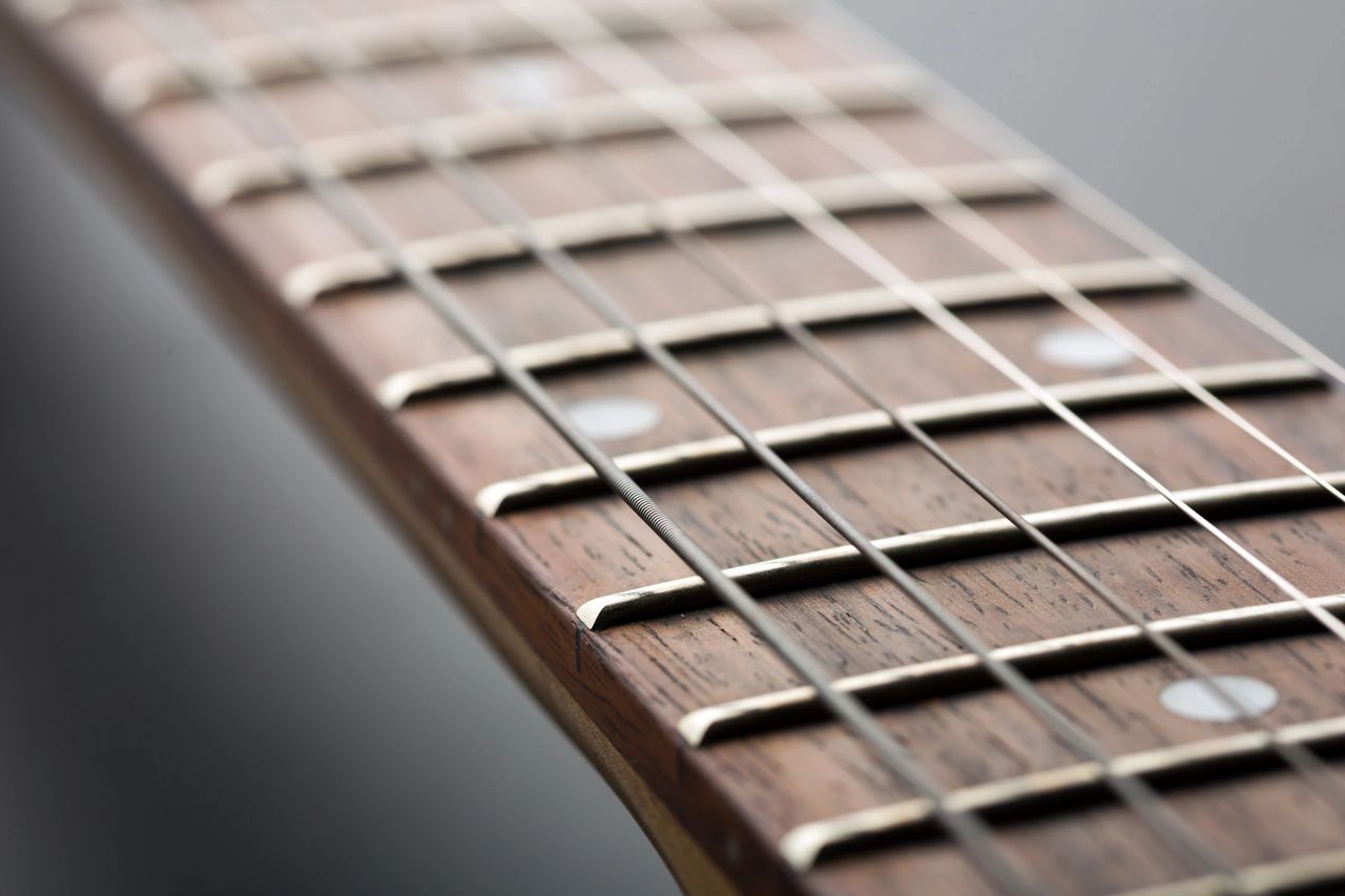 close up of a guitar neck - type of guitar necks - fretboard chronicles